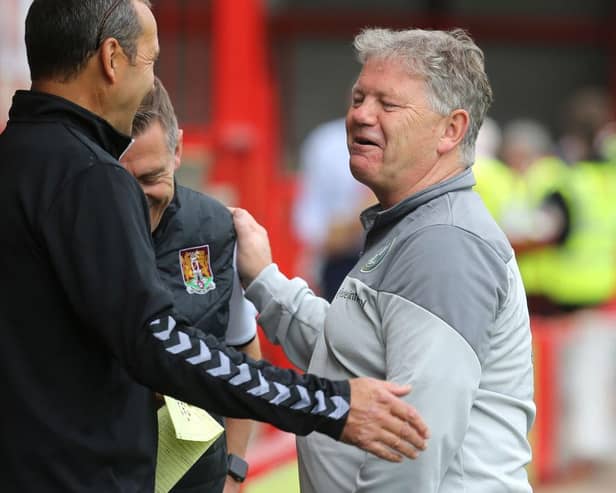 John Yems shares a pre-match joke with Jon Brady and Colin Calderwood. Picture: Pete Norton.
