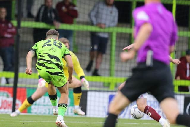 Josh March's shot deflects off Michael Harriman to put Forest Green Rovers into a 1-0 lead against the Cobblers