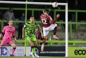 Scott Pollock heads home the Cobblers' equaliser at Forest Green Rovers (Pictures: Pete Norton)