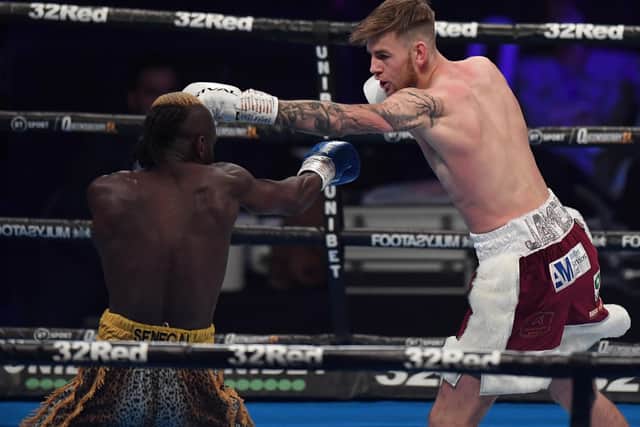 Matar Sambou is kept at arm's length by Eithan James