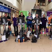 Northamptonshire Domestic Abuse Service riders cycle the distance from Northampton to Paris on static bikes at the Grosvenor shopping centre in Northampton on Satuday, August 28. Photo: Northamptonshire Domestic Abuse Service/Stu Vincent Photography
