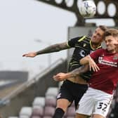 Cobblers striker Danny Rose battles for the ball in the clash with Scunthorpe United (Pictures: Pete Norton)