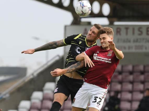 Cobblers striker Danny Rose battles for the ball in the clash with Scunthorpe United (Pictures: Pete Norton)