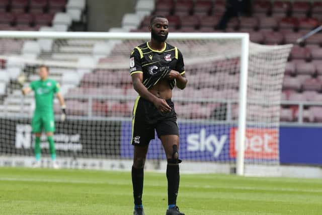 Scunthorpe's Emmanuel Onariase trudges off the Sixfields pitch after his first-half red card