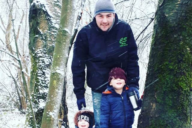 Oscar and Ethan with their dad.