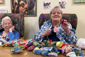Christa (left) and Jean Stephens (right) knitting little hats for Age UK Northamptonshire.