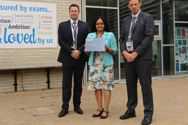 (L-R) Northampton Academy director of wellbeing Phil Swallow, director of STEM Shreeja Ashton and principal Chris Clyne celebrate the school receiving the We Invest in Wellbeing silver accreditation from Investors in People