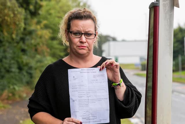 Lisa Pickering with her bailiff notice of enforcement. Photo: Leila Coker