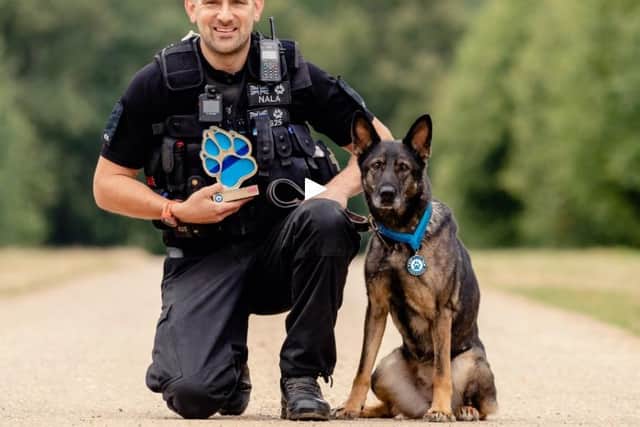 PC Sean Foster with Nala's Thin Blue Paw lifetime achievement award