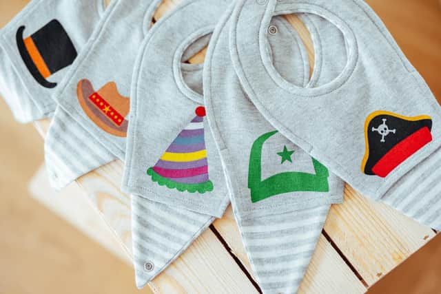 Clip-on bibs sold by Bibevie - made not to wear like a superhero cape!