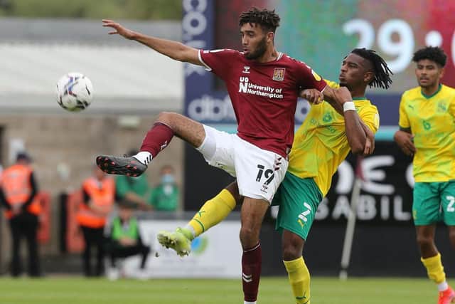 Kion Etete battles for possession against Swindon (Picture: Pete Norton)