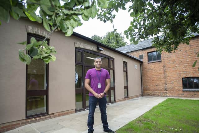 Councillor James Hill standing proud outside the Rectory Farm community centre after works were completed in March 2020. Pictures by Kirsty Edmonds.