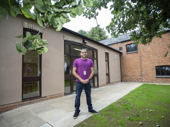 Councillor James Hill standing proud outside the Rectory Farm community centre after works were completed in March 2020. Pictures by Kirsty Edmonds.
