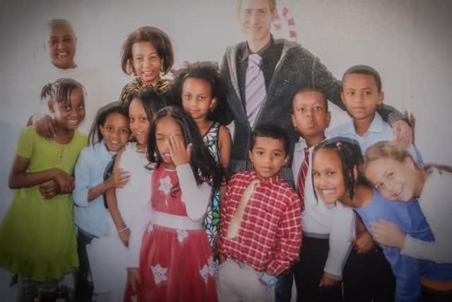 Christopher Allbury-Burridge with school children in Ethiopia. Photo courtesy of Northamptonshire Police