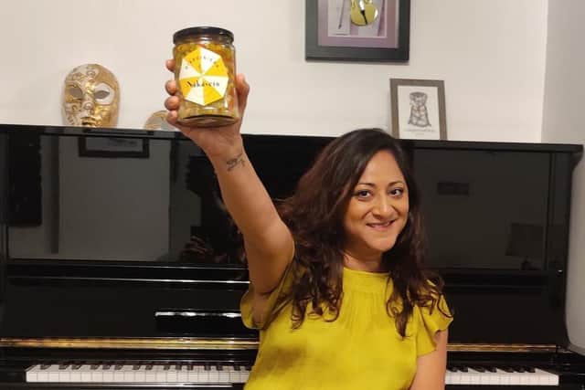 Founder of Nakasero Foods, Gita Raikundalia, holding her award-winning giardiniera.