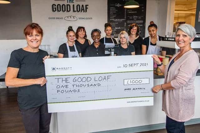 Chief executive at The Good Loaf, Suzy Van Rooyen (left) and Jacqui Patrick of Barratt Homes, with the £1,000 cheque.