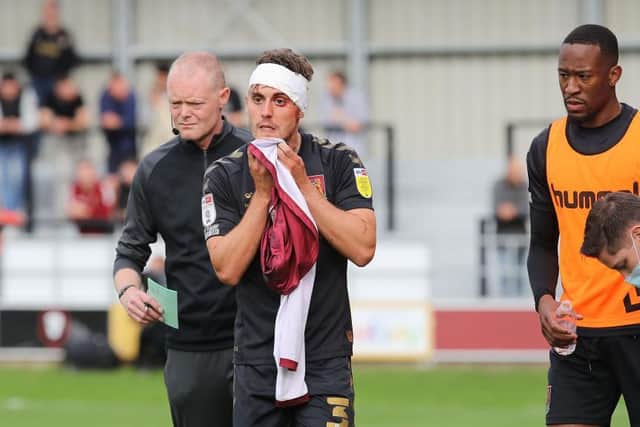 Danny Rose had to be patched up after taking a nasty blow to the head during the second-half of Saturday's game. Picture: Pete Norton.