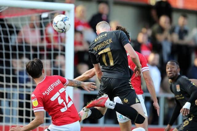 Mitch Pinnock heads past close friend and Salford goalkeeper Tom King. Picture: Pete Norton.