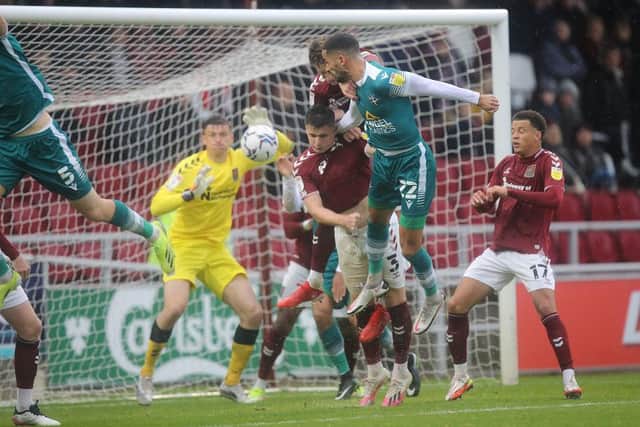 Joe Kizzi glances in to give Sutton a half-time lead. Pictures: Pete Norton.