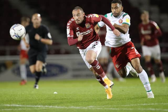 Michael Harriman, back in the team, goes haring after the ball during Tuesday's EFL Trophy match with Walsall. Picture: Pete Norton.