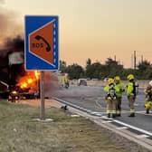 Firefighters tackle the blazing lorry on the M1 on Wednesday morning