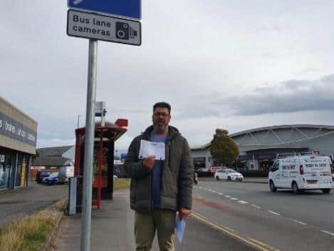 Mr Kahar stood next to the bus lane in St James' Road