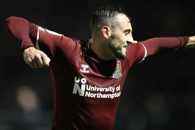 Dylan Connolly punches the air in delight after scoring from the spot.