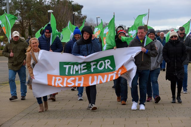 Ciara Ferguson MLA, Padraig Delargy MLA and Colr. Conor Heaney carry a banner during the Walk for Unity, along the Foyle embankment on Saturday morning last, calling on the British government for a referendum on Irish unification. Photo: George Sweeney.  DER2208GS – 091