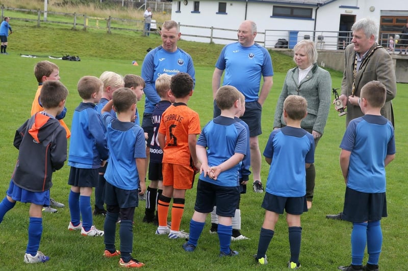 The Mayor of Causeway Coast and Glens Borough Council, Councillor Richard Holmes and Chairperson of Council’s NI 100 Working Group, Councillor Michelle Knight-McQuillan join a team talk at the Football Summer Camp in Portstewart