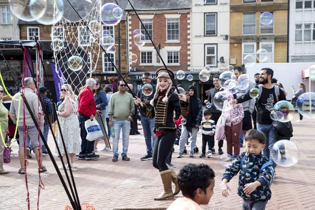 Hundreds enjoyed music, circus acts, and memories from the decade during a sixties celebration event in Northampton's Market Square on Saturday (September 24).