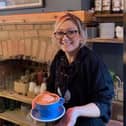 Jayne Catherine, known as the Latte Lady, is a barista at Lawrence's Coffeehouse.