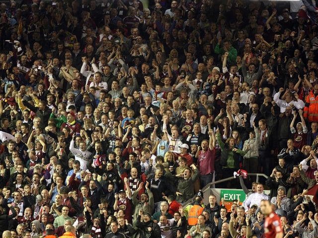 2010: Northampton Town fans celebrate after Billy McKay had scored his sides first goal during the Carling Cup Third Round match between Liverpool and Northampton Town at Anfield on September 22, 2010 in Liverpool, England. (Photo by Pete Norton/Getty Images)