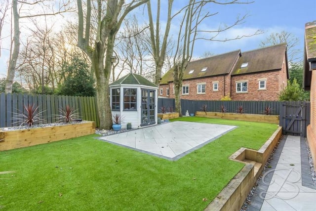 The back garden is a delight, with its artificial lawn, planters, mature trees and fence surround. Low maintenance but well maintained.