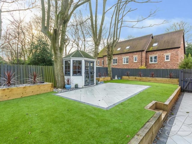 The back garden is a delight, with its artificial lawn, planters, mature trees and fence surround. Low maintenance but well maintained.