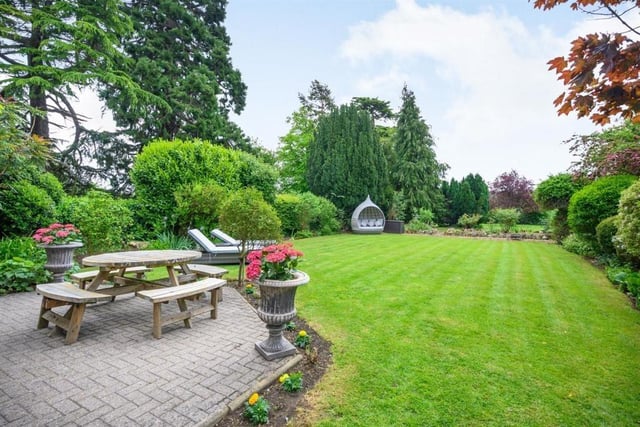 This Victorian home has a tennis court, huge gardens and a private mooring on the River Nene.