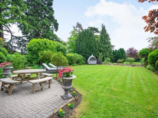 This Victorian home has a tennis court, huge gardens and a private mooring on the River Nene.