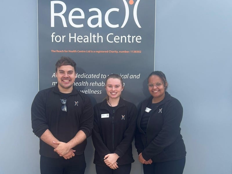 The Reach for Health Centre staff members Vintonie, Sophie, and Dan pictured together.