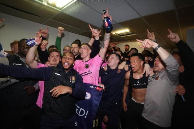 The Cobblers squad celebrate their promotion at Tranmere Rovers in May (Photo by Pete Norton/Getty Images)
