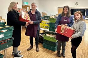 Kristy Hobbs and Niamh Coleman of Orange Juice Communications handing over 288 mince pies to Brixworth Community Food Share.