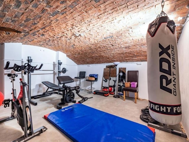 This Victorian home has a tennis court, huge gardens and a private mooring on the River Nene.