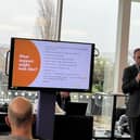 One of the team tell businesses about the support they can help with at the last event
