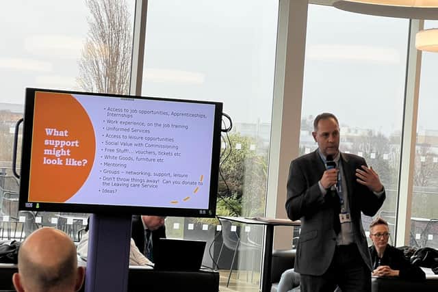 One of the team tell businesses about the support they can help with at the last event