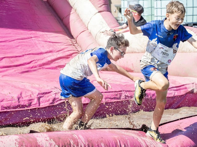 Children were all smiles on Saturday July 12 when they took part in the Race for Life, five kilometre obstacle course in Abington Park, Northampton.