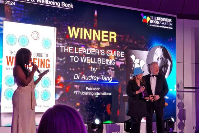 Dr Audrey Tang accepting the book award