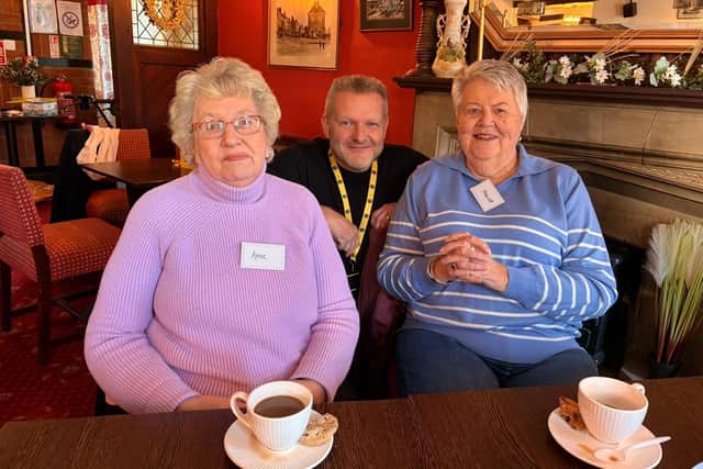 Two ladies attending the Chatty Cafe session at The Crown with Jon Haslam, the volunteer host