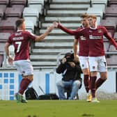 Mitch Pinnock is congratulated by his team-mates after giving Cobblers the lead against Fleetwood. Picture: Pete Norton