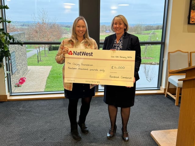 Naomi Rees-Issitt, Our Jay Foundation founder and head of trustees, and Lorraine Marley, Rugby Borough Council’s bereavement services manager, pictured at the cheque presentation at Rainsbrook Crematorium.