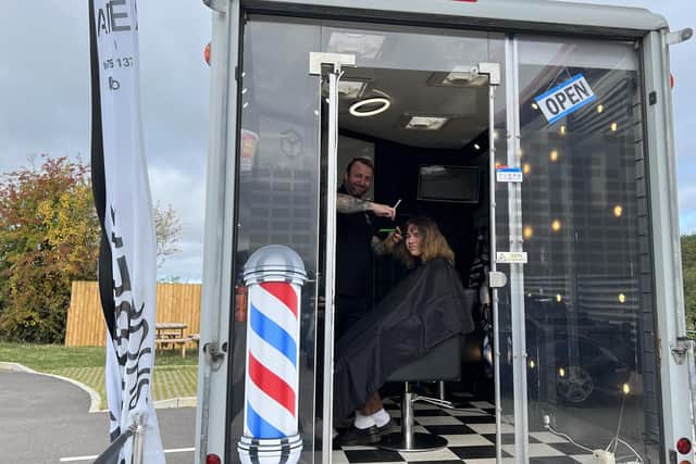 A customer dropping in on Barber Box 1