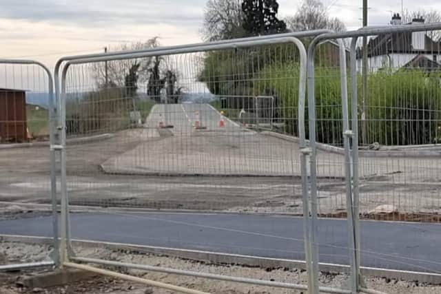 Nick Chambers says his driveway (next to the cones) has been moved to the brow of a hill by developers. The road's speed limit is currently 60mph.