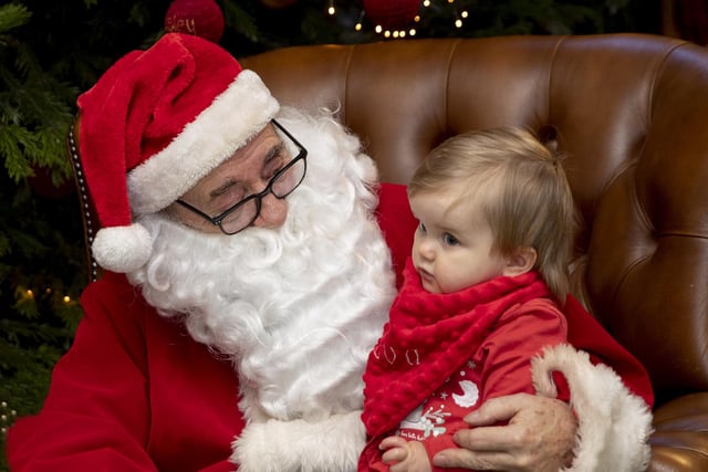 Children meet Father Christmas at Delapre Abbey in December 2022.